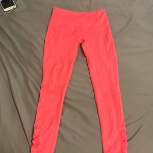 neon pink fr movement leggings. very form fitting